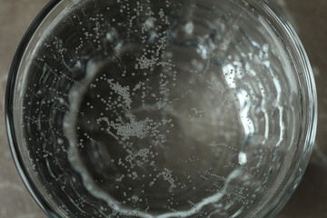 Glass full of mineral water, close up