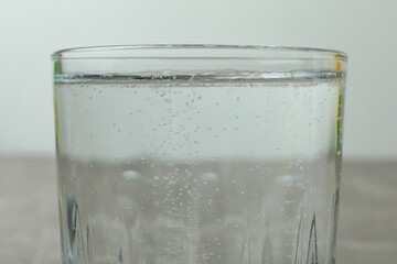 Glass full of mineral water, close up