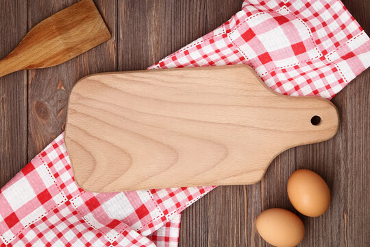 Empty wood cutting board on the table with food. Kitchen template, mockup, flat lay