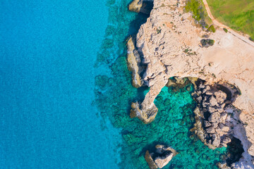 Fototapeta na wymiar Coast of Cyprus. Ayia Napa resort. Mediterranean coast. Beach and cliffs not far from Paphos town. Тature of island of Cyprus. Mediterranean Sea landscape. Rocky beaches of Cyprus. Cape Greco cruise