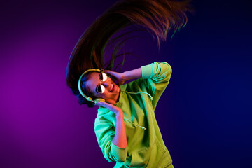 Photo of funky crazy young woman listen music long hair fly disco headset isolated on colorful gradient background