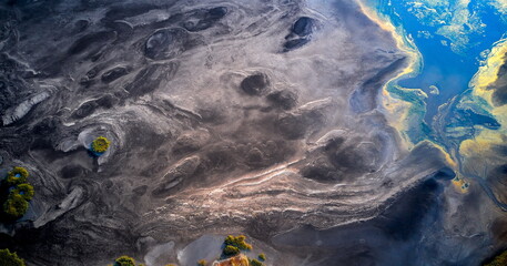 Dry lake or swamp in the process of drought and lack of rain or moisture, a global natural disaster - aerial drone view