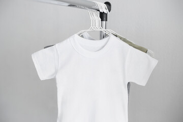 White tshirt mockup on the hanger. Template, kid, child shirt, summer clothes mock up