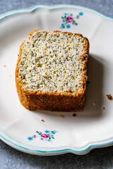 Homemade Lemon Cake Slice with Poppy Seeds served in Plate.