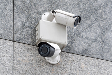 Security cameras on modern building. Professional surveillance camera. CCTV on the wall with LED IR...
