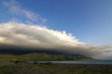 Cumulonimbus cloud over lake Maloye Chebachye before a thunderstorm.
