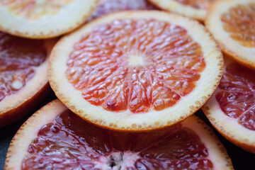 Grapefruit and orange half isolated on white background. Grapefruit half macro studio photo. Orange...