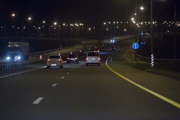 Fototapeta na wymiar Car traffic at night on a motorway