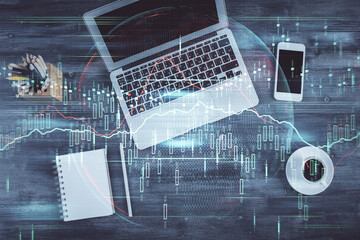 Double exposure of forex chart drawing over table background with computer. Concept of financial research and analysis. Top view.