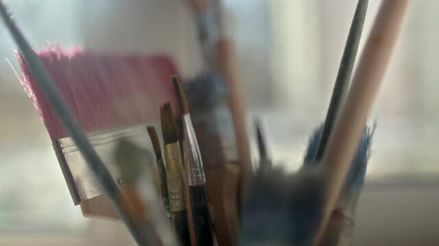 slow slide with artist's brushes