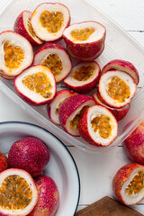 Passion fruit on wooden white background