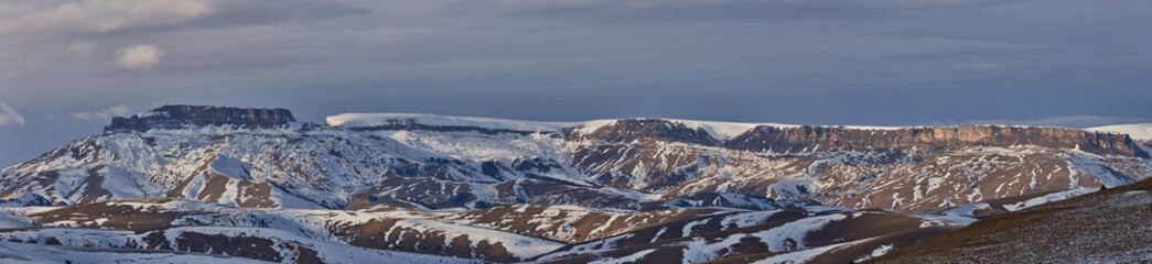 Fototapeta na wymiar Panorama of the winter Bermamyt Plateau part of the Rocky Ridge of the Greater Caucasus