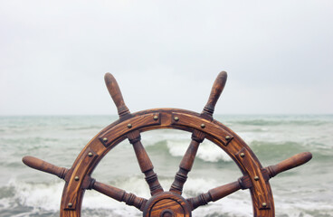Steering wheel ship against the background of the sea