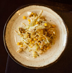 warm salad with chicken, cabbage and with corn and mustard sauce