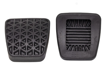 Rubber spare parts for cars. Closeup of two new rubber covers for Clutch pedal and brake pedal for cars isolated on white background. Front and back view. Macro.