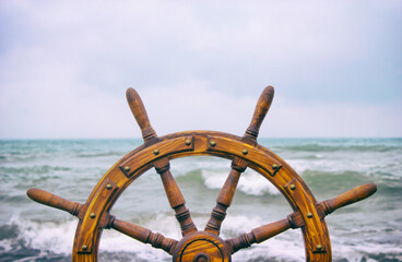 Steering wheel ship against the background of the sea
