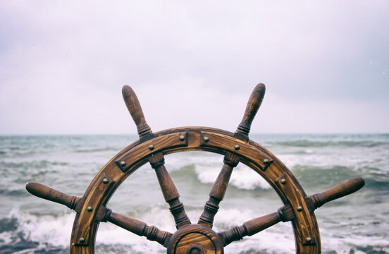 Steering wheel ship against the background of the sea