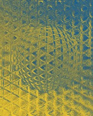 geometric hexagonal mosaic in shades of blue and yellow on a black background with 3D sphere object