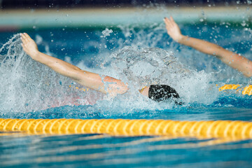Swimming crawl sportsman with splashes