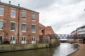 Fototapeta na wymiar Wolverton Grand Union Canal and old, converted buildings.