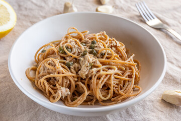 Spaghetti with tuna and capers. Typical Italian pasta dish with tuna.
