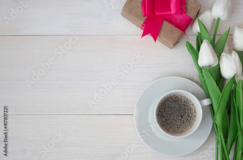 Coffee mug with a bouquet of tulips, gift box. Happy Mother's Day, Women's Day.