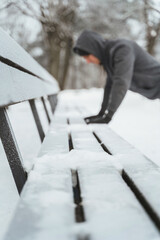 Athletic man doing push ups during his calisthenics winter workout