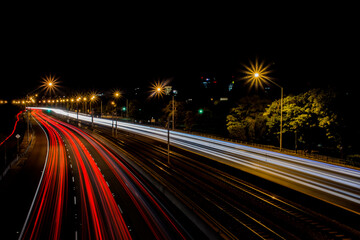 Fototapeta na wymiar Light trails on a motorway at night, Perth, Western Australia, Australia