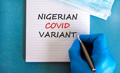 New covid-19 nigerian strain symbol. Hand in blue glove with white card. Concept words 'nigerian...