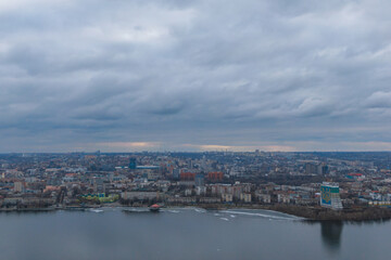 Dark clouds over the city in spring with drone