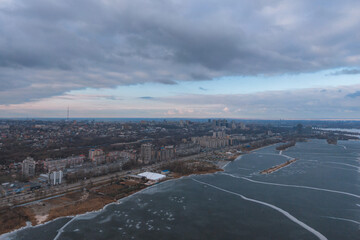 Dark clouds over the city in spring with drone