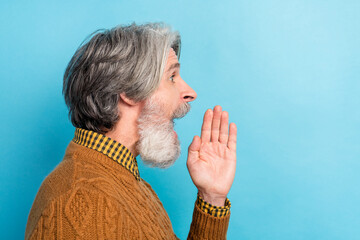 Side profile photo portrait of man looking copyspace shouting news isolated vibrant blue color...