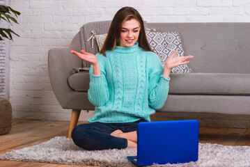 Beautiful girl is a blogger. She spends time at an online laptop conference