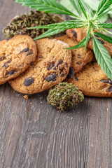 Cookies with cannabis and buds of marijuana on the table. A can of cannabis buds CBD Concept of cooking with cannabis herb. - Medical Legal Marijuana