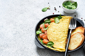 Salmon and spinach omelet with bread dough for breakfast. Good morning.