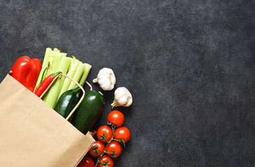 food shopping or delivery concept, fresh vegetables  in a paper bag.