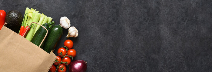 food shopping or delivery concept, fresh vegetables  in a paper bag.