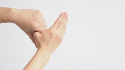 Male model is rub thumb on white background.