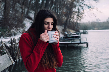 Woman at winter outdoors - 417814828