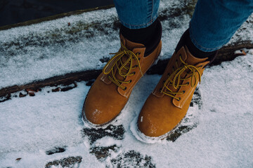 Winter boots on snow - 417815044