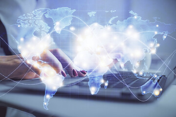 Multi exposure of woman hands typing on computer and business theme hologram drawing. Success concept.