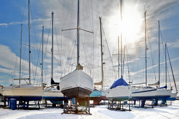 Boats on the snow at Shotley Marian, Suffolk, England