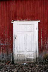 old wooden door in red wall