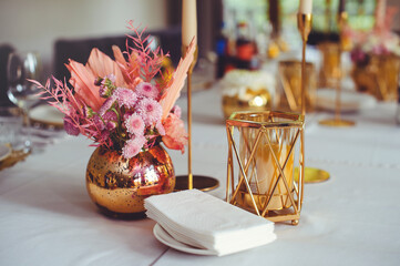 Luxurious floral arrangement of pink and white flowers fixed on the wall