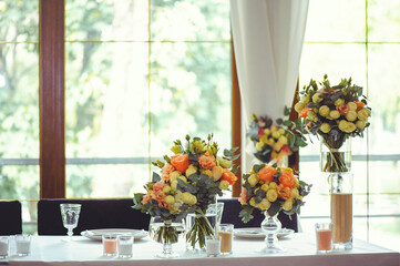 Luxurious floral arrangement of pink and white flowers fixed on the wall
