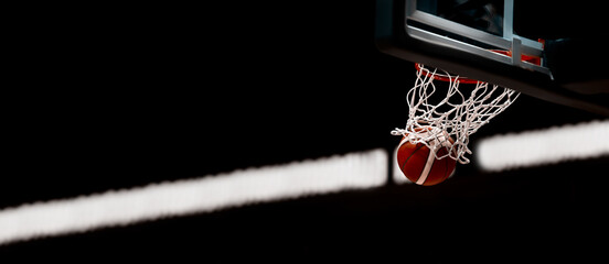 The orange basketball ball flies through the basket. Sports background for product display, banner, or mockup. Vintage color filter.