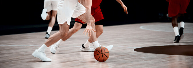 Professional basketball players in action. Sports background for app, banner, or mockup