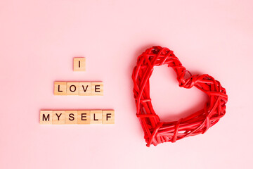 Written phrase I love myself with heart on pink background. Concept mental health journaling,...