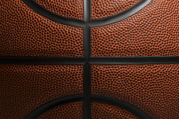Closeup detail of basketball ball texture background. Team sport concept. Sports background for product display, banner, or mockup.