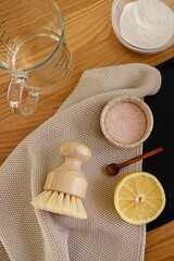 Step by step instruction of non toxic home cleaning detergent recipe made of vinegar, baking soda and lemon. Eco friendly zero waste household concept.